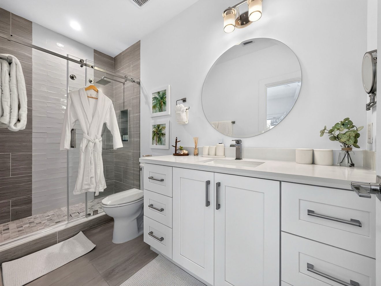 Full bathroom with glass walk-in shower and vanity