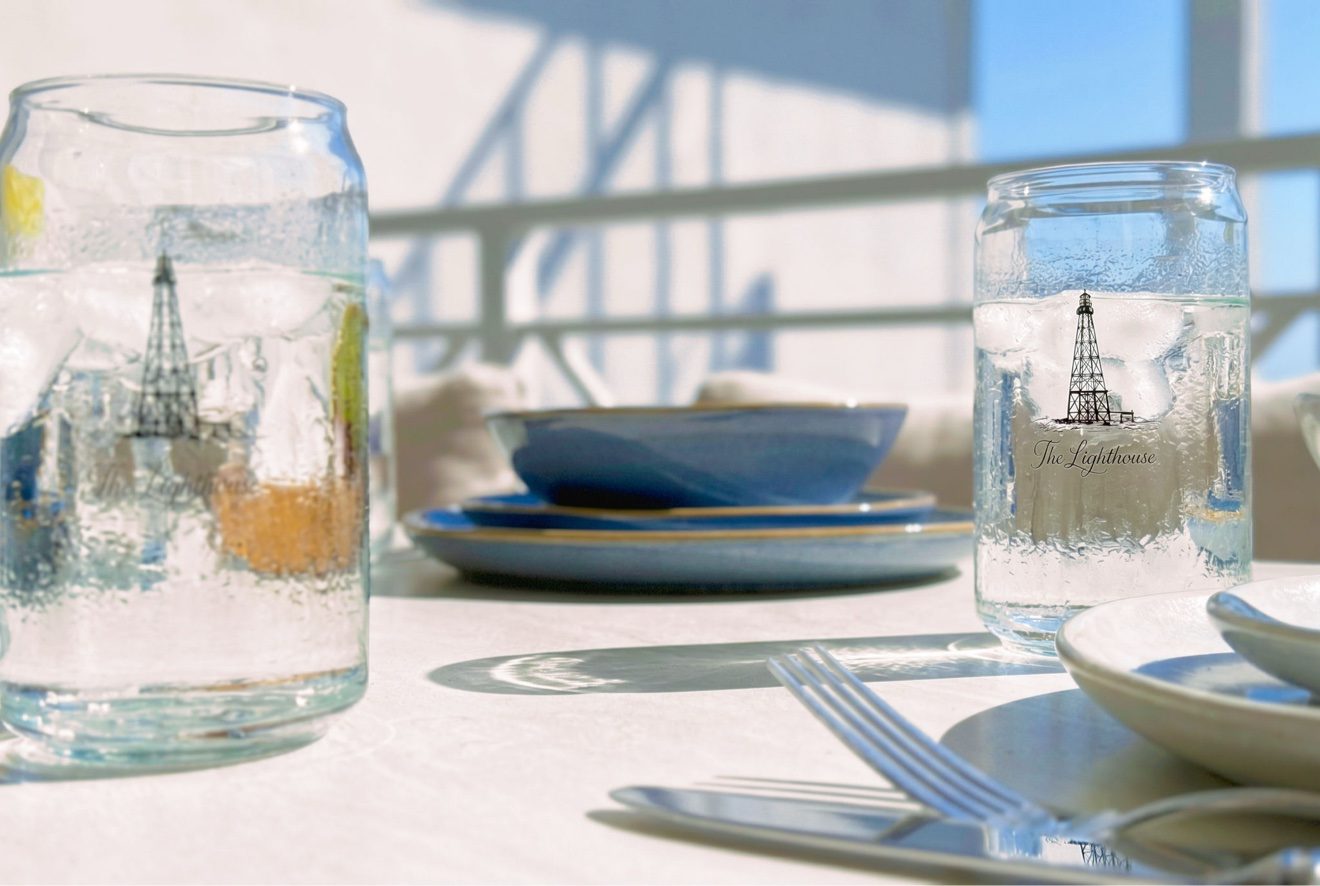 Branded glassware set on the balcony dining table