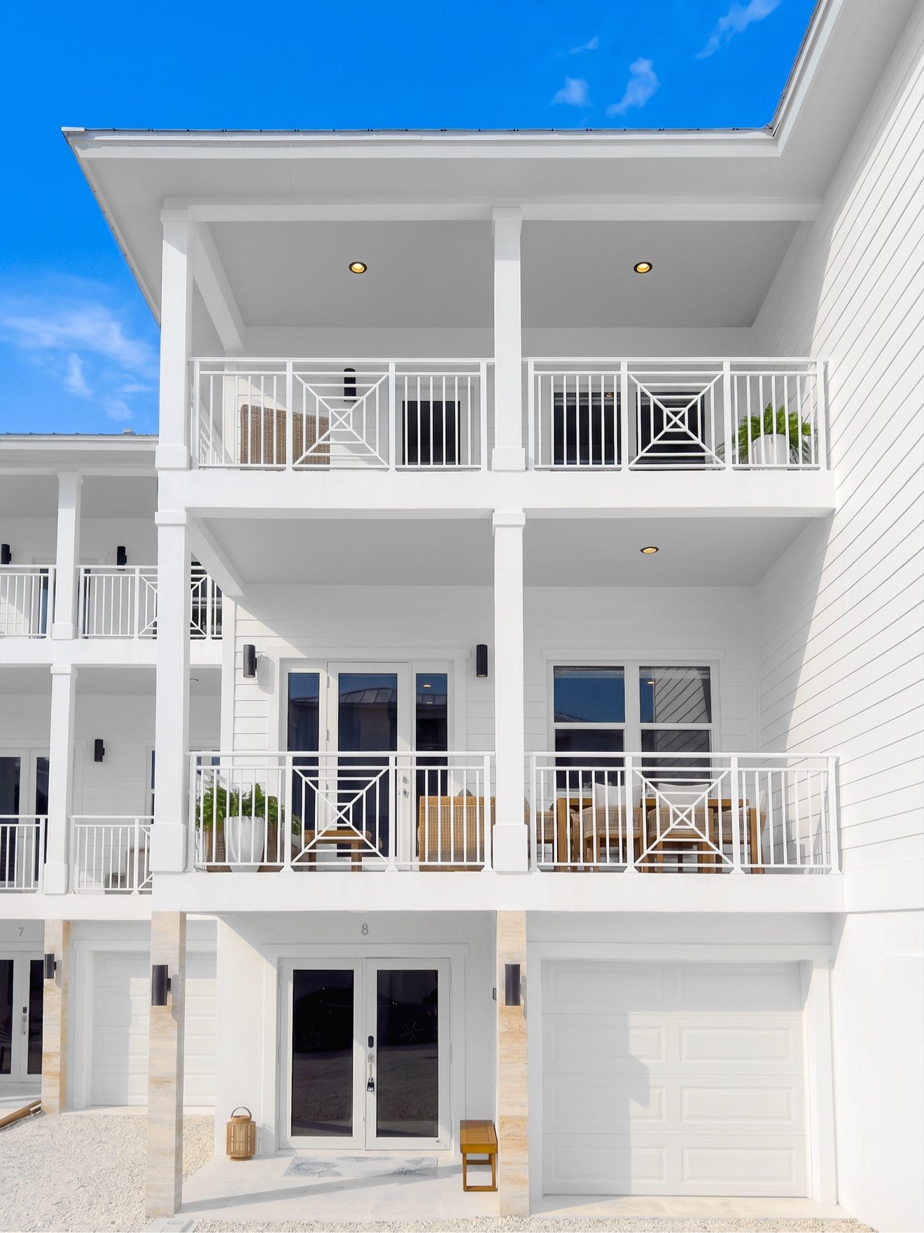 Exterior of The Lighthouse villa, unit 8, with stacked ocean-facing balconies